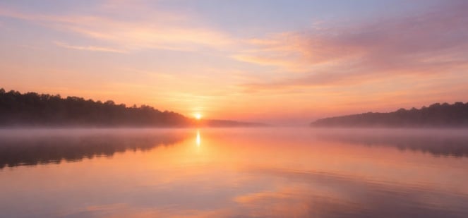 funeral homes Loudonville, NY peaceful sunrise over a calm lake